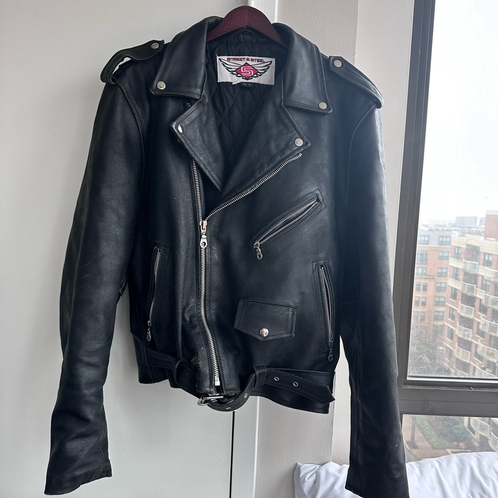 Heavy duty leather motorcycle jacket. Very warm. Zippers work